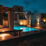 ANEMELA Villas and Suites outdoor image of the pool at night
